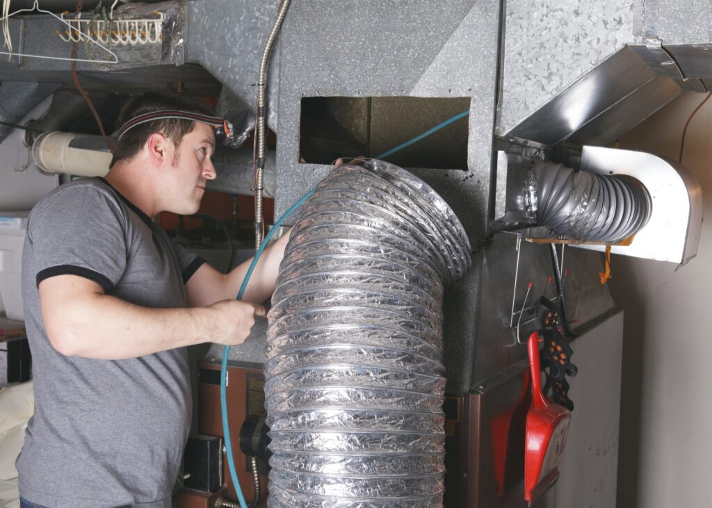 tech-working-on-duct